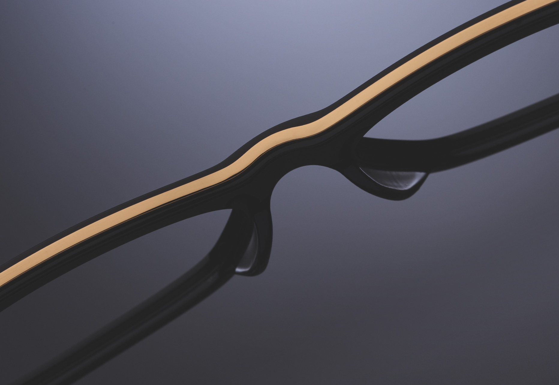 THIN TITANIUM INLAY EXTENDS THE ENTIRE LENGTH OF THE FRAME