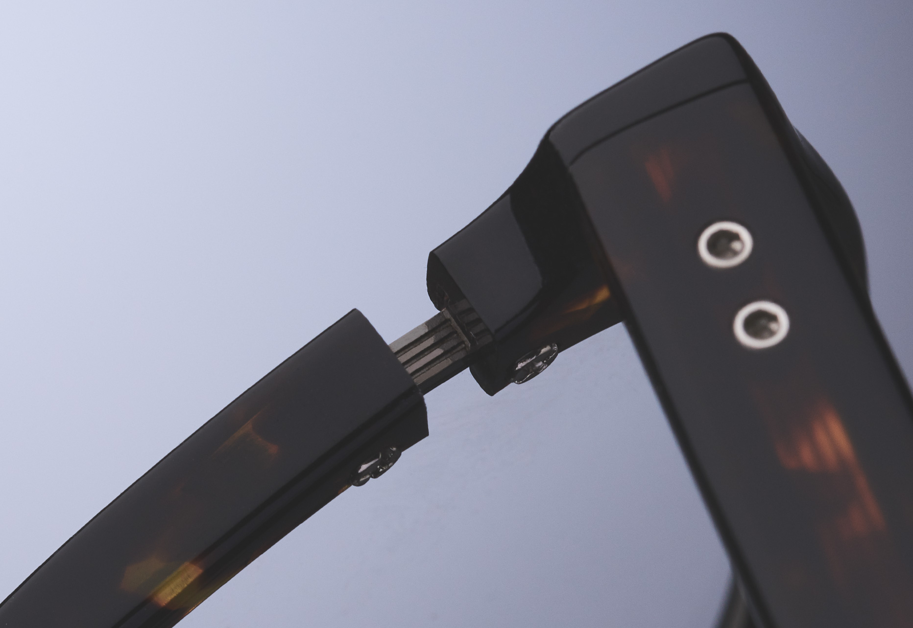 ACETATE CUT OUTS TO EXPOSE METAL DETAILS AND AN INNOVATIVE CLIP MOUNTING SYSTEM